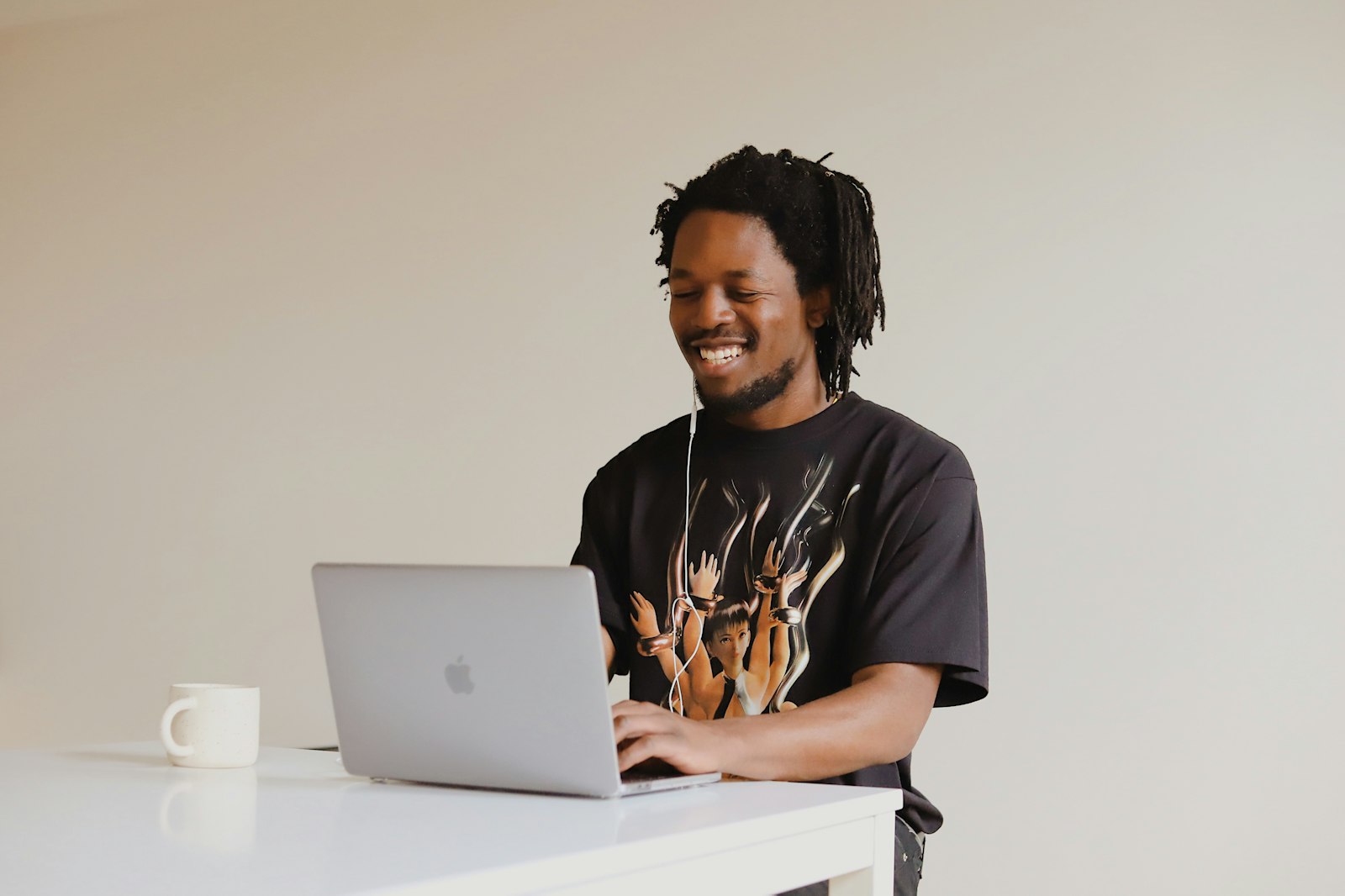 Online educator teaching with a laptop and headphones