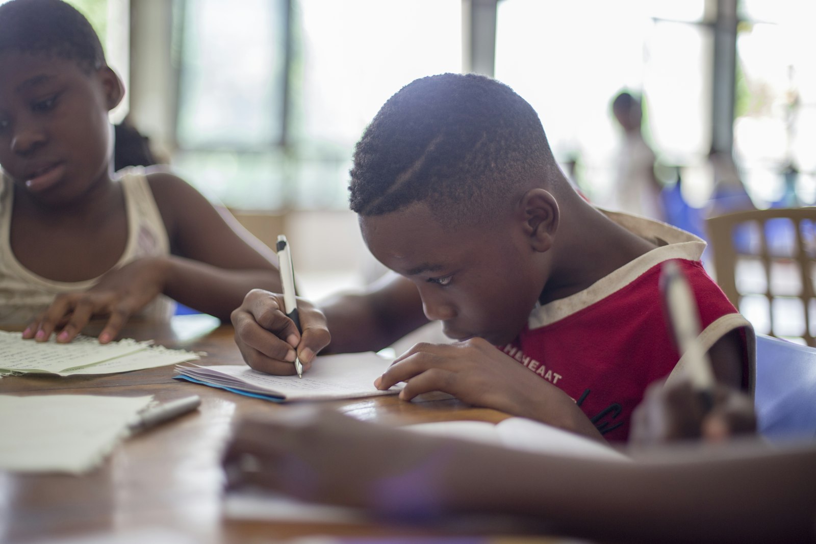 Primary students writing in a Writing Club class